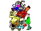 A man with a shopping trolley loaded high with all this worldly goods `For Sale`